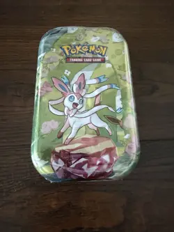 Pokemon Prismatic Evolutions Sylveon Mini Tin Sealed - Contains 2 Booster Packs! - Image 1