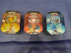 Pokemon Hidden Fates Tins Charizard Gyarados Raichu GX Boxes - Set of 3 - Image 1