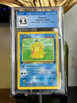 2000 Pokemon Team Rocket 1st Edition Psyduck #65 CGC Graded 9.5 Gem Mint - Image 1