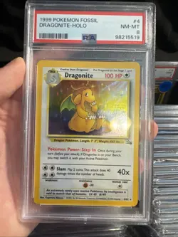 Pokemon Dragonite Fossil Unlimited Holo Rare #4 PSA 8 - Image 1