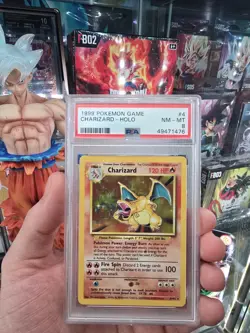 1999 Pokemon Base Set Charizard Holo Rare 4/102 PSA 8 NM/M - Image 1