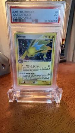 Pokemon PSA 7 NM Jolteon 8/115 Unseen Forces Reverse Holofoil 2005 - Image 1