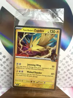 Team Rocket’s Zapdos Gamestop Promo Stamp Sealed Pokemon Card - Image 1
