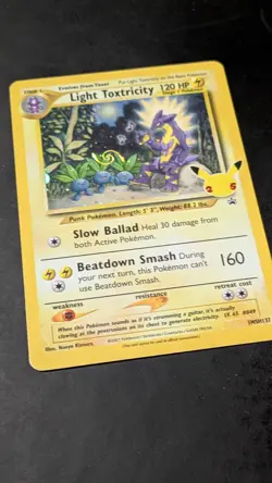 a SWIRL Light Toxtricity SWSH137 SWSH: Sword & Shield Promo Cards Holo - Image 1