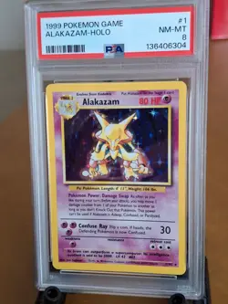 1999 Pokemon Base Set Alakazam Holo #1 - PSA 8 NEAR MINT to MINT! - Image 1