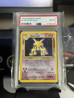 1999 POKEMON BASE SET UNLIMITED #1 ALAKAZAM-HOLO PSA 8 GREAT HOLO PATTERN - Image 1