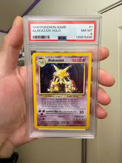 1999 POKEMON BASE SET UNLIMITED #1 ALAKAZAM-HOLO PSA 8 - Image 1