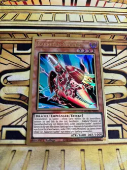 Yugioh Rakketen-Sucher MGED-DE020 Premium Gold Rare - Image 1