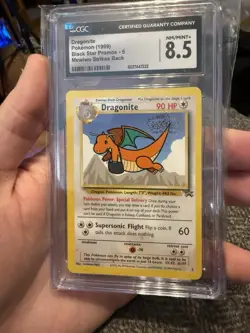 1999 Pokemon Dragonite Black Star Movie Promo 5 CGC 8.5 - Image 1
