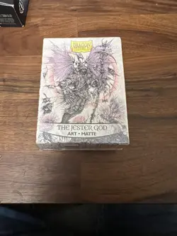 Dragon Shield “The Jester God” Card Sleeves Arcane Tinmen Ian Miller art - Image 1
