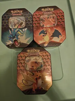 Pokemon Hidden Fates Tins (Set of 3 Tins) - Charizard, Raichu, Gyarados Art Set - Image 1