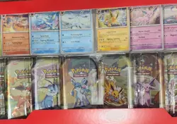 Pokemon Prismatic Evolutions Costco Sealed Mini Tins (8x) IN HAND - Image 1