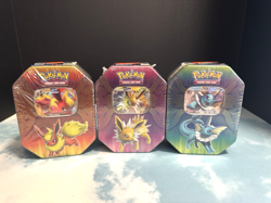 Pokemon Tins 2019 Elemental Powers Jolteon Vaporeon Flareon GX Sealed Set of 3 - Image 1