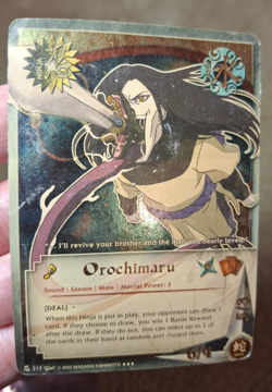 SHONEN JUMP NARUTO CCG OROCHIMARU GOLD CARD #217 - Image 1