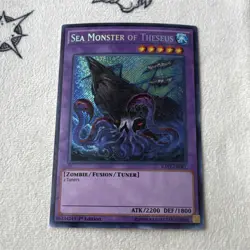 Yu-Gi-Oh! TCG Sea Monster of Theseus RATE-EN081 Raging Tempest Unlimited Secret. - Image 1