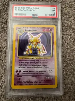 1999 POKEMON TCG GAME BASE SET ALAKAZAM HOLO - #1 PSA 7 NEAR MINT - Image 1