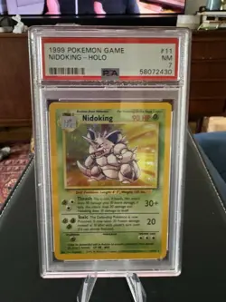 1999 POKEMON BASE SET UNLIMITED #11 NIDOKING-HOLO PSA 7 - Image 1
