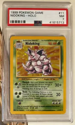 1999 POKEMON BASE SET UNLIMITED #11 NIDOKING-HOLO PSA 7 - Image 1