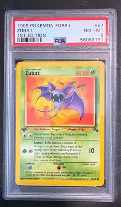 1999 Pokemon Fossil 1st Edition 57 Zubat PSA 8 - Image 1