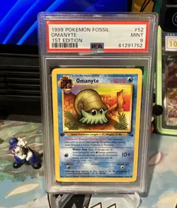 1999 POKEMON FOSSIL 1ST ED #52 OMANYTE PSA 9 - Image 1