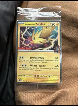 Team Rocket’s Zapdos 70/182 GameStop Stamped Promo Sealed Destined Rivals TCG - Image 1