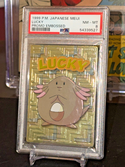 1999 POKEMON Japanese MEIJI Lucky - Embossed NM-MintPSA 8 - Image 1