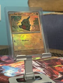 Pokemon Larvitar (Master Ball Pattern) 047/131 Prismatic Evolutions Holo TCG NM - Image 1