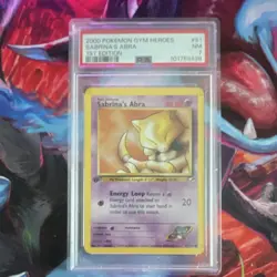 Sabrina's Abra 091/132 Gym Heroes 1st Edition Regular PSA 7 Pokemon TCG Card - Image 1