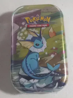 POKEMON PRISMATIC EVOLUTIONS VAPOREON MINI TIN NEW/SEALED MINT - Image 1