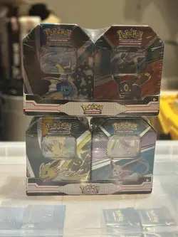 Pokemon TCG V Heroes Bundle Tins: 2-Pack of Vaporeon & Umbreon Jolteon & Espeon - Image 1