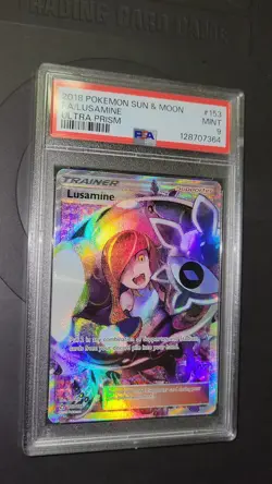 2018 POKEMON SUN & MOON ULTRA PRISM #153 FULL ART/LUSAMINE PSA 9 - Image 1
