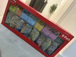 Pokemon TCG: Scarlet & Violet Prismatic Evolutions 8 Pack Mini Tin Set (Costco) - Image 1