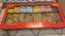 Pokemon TCG: Scarlet & Violet - Prismatic Evolutions 8 Pack Mini Tin Set - Image 1
