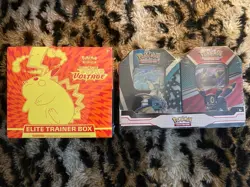 Pokemon Sealed Lot Vivid Voltage ETB & Vaporeon Umbreon V Heroes Tin Bundle - Image 1