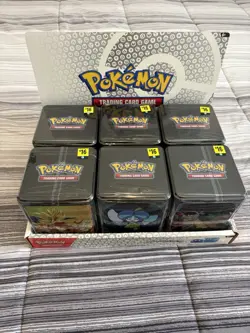 Pokemon TCG: Stacking Tins 2025 Factory Sealed 6 Tin Box With Store Display Case - Image 1