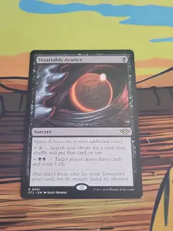 Insatiable Avarice Outlaws of Thunder Junction Regular - Image 1