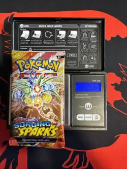 22.56g HEAVY - Pokemon TCG S&V Surging Sparks Booster Pack Sealed / Semi GoDU - Image 1