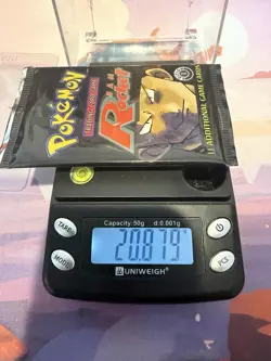 Pokemon First Edition Sealed Team Rocket Booster Pack - HeavyU (20.879g) WOTC - Image 1