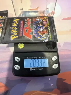 Pokemon First Edition Sealed Team Rocket Booster Pack - HeavyU (20.98g) WOTC - Image 1