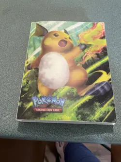 Pokemon Trading Card Game binder. It Includes Several Cards in it. ￼ - Image 1