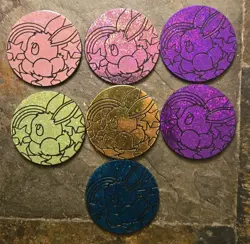 Lot Of 7 Pokemon TCG EEVEE Coins Prismatic Evolutions Variety Of Colors - Image 1
