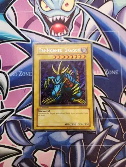 Tri-Horned Dragon Secret Rare Yu-Gi-Oh Card 1st Edition LOB-E000 - Image 1