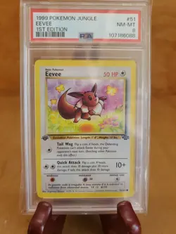 1999 POKEMON JUNGLE EEVEE 1st EDITION #51 PSA 8 NM-MT 107186088 - Image 1