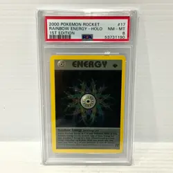 Rainbow Energy 17/82 - Holo 1st Edition - Team Rocket - PSA 8 - Graded Pokemon - Image 1