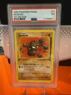 1999 POKEMON FOSSIL 1ST EDITION #47/62 GEODUDE PSA 7 - Image 1