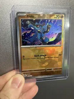 Pokemon TCG Prismatic Evolutions Riolu Card 050/131 Master Ball Reverse Holo - Image 1