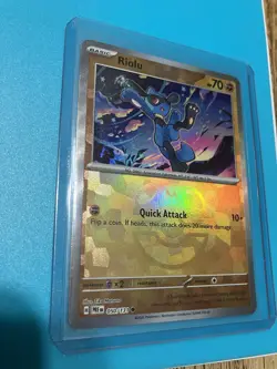 Pokemon TCG Prismatic Evolutions Riolu Card 050/131 Master Ball Reverse Holo - Image 2