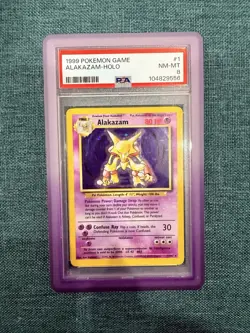 1999 Pokemon TCG Alakazam Base Set Holo Unlimited Rare Card 1/102 PSA NM-MT 8 - Image 1
