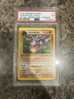 1999 POKEMON FOSSIL 1ST ED-PRERELEASE-COSMOS #1 AERODACTYL-HOLO PSA 7 - Image 1