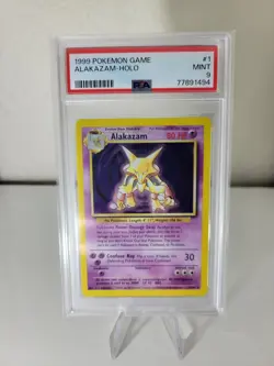 1999 Pokemon TCG Alakazam Base Set Holo Unlimited Rare Card 1/102 PSA 9 - Image 1